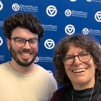 Two event attendees smiling for camera